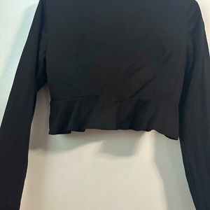 Black open front shawl collar Valero with ruffle detail on the back. NWOT